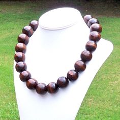 Chunky Wood Necklace Large Wood Necklace Big Wood Bead Necklace Bohemian Necklace Boho Necklace 25mm Round Dark Brown Wood Bead Necklace This modern beauty was hand beaded using large and chunky 25mm round deep brown wooden beads. The necklace measures your choice of 22, 25, 30, or 38 inches long and is securely fastened with a silver clasp. The end result is a chic bohemian piece that fits in perfectly with today's fashion trends! Length can be adjusted if needed - just ask! Check out more fabu Wooden Beads Necklaces For Jewelry Making, Round Wooden Beads Necklaces For Jewelry Making, Brown Wooden Beads Round Jewelry, Brown Wooden Beads Jewelry, Brown Round Wooden Beads Jewelry, Wooden Beads Round Necklace As Gift, Wooden Beads Necklace Gift, Brown Round Bead Necklaces For Jewelry Making, Gift Wooden Beaded Round Necklace