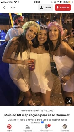 three women in white dresses posing for the camera with their arms around each other and smiling