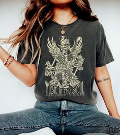 Rock n Roll Shirt, Music In The Soul T-Shirt, Lao Tzu Quote, Vintage Style Rock and Roll Tee, Angel Skeleton With Guitar, Artful Music Gift Our Unisex t-shirts are premium quality, SUPER soft and breathable, medium weight, and 100% ring-spun cotton. We use Comfort Colors for our t-shirts and our customers love everything about them!   FABRICATION: Unisex Garment-Dyed T-shirt Comfort Colors® 1717 * 100% ring-spun cotton * Medium fabric (6.1 oz/yd² (206.8 g/m²) * Relaxed fit * Runs true to size SI Skeleton With Guitar, Angel Skeleton, Rock N Roll Shirt, Lao Tzu Quotes, Festival 2024, Rock Tees, Style Rock, Lao Tzu, Rock T Shirts