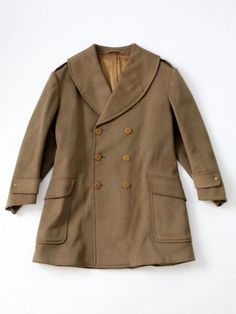 This is a vintage US Army colonel's wool coat dated 1940.  Just prior to WWII, the wool "Mackinaw" jacket was custom made by Max Wax for Colonel T.L. Ferenbaugh at Fort Ethan Allen in Vermont.  Classic double breasted jacket with pockets at waist and single split in back. CONDITIONIn good condition with wear consistent with age and use.  Some moth wear to the wool in spots. MARKED:  B 45 SL 34MEASUREMENTSBust45 inch..  114.3 cmLength36.25" ..92.1 cmShoulders18.5" ..47 cmNeck to Sleeve End35 inch Winter Military Outerwear With Buttons, Military Coats, Military Cotton Outerwear With Lapel Collar, Buckskin Dress, Army Dress, Vintage Military Outerwear With Buttons, Army Officer, Military Aesthetic, Brown Military Outerwear With Button Closure