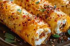 Oven Fried Feta Rolls with Chili Honey Oven Snacks Recipes, Quick Christmas Meals, Feta Rolls With Chili Honey, Greek Foods For Party, Oven Fried Feta Rolls With Chili Honey, New Years Food Ideas Easy, Greek Christmas Food, Feta Appetizers For Party, Savoury Snack Ideas