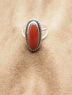 Carnelian Agate Ring US Size 7. Can be resized for no additional cost  Top: 26 mm x 13 mm; 1" x  1/2" Weight 6.2 Grams Sterling Silver 925, Handmade $65 Exclusively Designed by Richard James for Richlo Jewelry Check out our other fine jewelry at:https://www.etsy.com/shop/arizonagemstudio Red Carnelian instills a confident sense of self-assurance. It is the color of life, passion, and energy. It inspires. It's a vibrant color, reminiscent of fire.