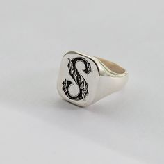 * This Initial Signet ring is stylish and pretty ideal for everyday use. Engraving details of 925k handmade silver ring are very detailed and eye-catching. The ring is coated with rodium to emphasize the details of handmade engraving * - Material: High Quality Solid 925 Sterling Silver - Surface width: 15mm x 17mm = 0.59 Inch x 0.67 Inch - Engraved Signet Ring will be completely handmade. - I hope this elegant but stylish ring is also a great personalized Birthday Gift. A special piece you'll tr Men Signet Ring, Ring For Women Gold, Engraved Signet Ring, Silver Ring For Men, Promise Rings For Him, Signet Rings Women, Handmade Silver Ring, Biker Jewelry, Engraved Ring