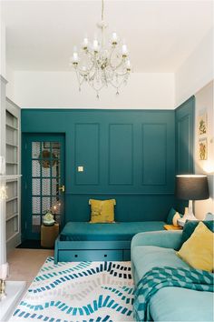 a living room filled with furniture and a chandelier