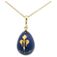 Fabergé egg-shaped pendant necklace, 18k yellow gold, translucent blue enamel with fleur de lys paillon, limited edition. Reference: F1589/BL/00/01/102 _V1712/00/00/00/10250 Brand: Faberge Workmaster: Victor Mayer Material: 750/- yellow gold (18k) Shape: egg pendant Vitreous enamel: Translucent royal blue Paillons: five yellow gold paillons, a >fleur de lys< as the central motif. Limited edition: 500 pieces Individual number: 31 / 500 Chain: 50cm 18K yellow gold chain (V1712/00/00/00/10250) by V German Jewelry, French Royalty, Military Insignia, Vitreous Enamel, Historical Jewellery, Faberge Eggs, Luminous Colours, Iris Flowers, Modern Necklaces