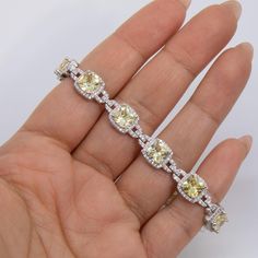 Yellow CZ Cushion Link Tennis Bracelet Sterling Silver 925 * Metal : Real Sterling Silver (Properly Stamped, 925) * Condition : Brand New * Finish : Polished * Average Weight : 21.89 grams * Length : 7.5" * Width : 9.5mm = 3/8" * Clasp/Bail : Figure 8 Safety Clasp All of our items are brand new and are shipped with a gift box. Yellow Cushion, Yellow Cushions, Bracelet Tennis, Figure 8, Average Weight, Fine Jewelry Bracelets, Bracelet Sterling Silver, Jewelry Business, Bracelets And Charms