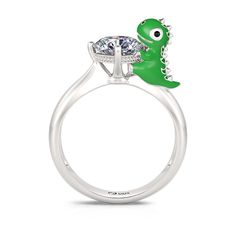 Daspletosaurus, also known as Tyrannosaurus, is a genus of dinosaurs under the family Tyrannosaurus that lived in western North America during the Upper Cretaceous period, 77 million to 74 million years ago. This Jeulia Hug Me® ring is made of sterling silver, vividly presenting the cute posture of a cartoon daspletosaurus. It will be perfect gift for dinosaur lovers or just add an special addition to your jewel collection. You will find more adorable and creative designs in our Hug Me® collecti Dinosaur Rings For Couples, Cute Dinosaur Rings, Dinosaur Belly Button Ring, Dinosaur Bone Ring Jewelry By Johan, Dinosaur Rings, Me Cartoon, Dinosaur Ring, Cretaceous Period, Cartoon Dinosaur