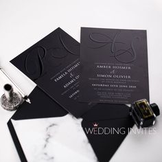 the wedding stationery is laid out and ready to be put into its guests'bags