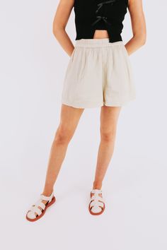 Unleash those legs in FREE PEOPLE's Get Free Poplin Pull On Shorts! With an elastic waist, these shorts are perfect for a comfortable and playful summer look. Say goodbye to restrictive waistbands and hello to effortless style! Details Elastic waist Sizing Approximate measurements: SIZE LENGTH/INSEAM WAIST XSmall 14/13" 27" Small 15/14"﻿ 30"﻿ Medium 15.5/15"﻿ 32"﻿ Large 16/15.5"﻿ 33"﻿ XLarge 17/16" 34" Fabric has stretch in the waistbandModel is 5’10 wearing small Material 62% Cotton 32% Viscose Vacation Paperbag Waist Shorts With Elastic Waistband, Vacation Paperbag Waist Shorts With Elastic Band, Vacation Shorts With Elastic Paperbag Waist, Vacation Bottoms With Built-in Shorts And Adjustable Waist, Chic Relaxed Fit Shorts With Elastic Waistband, Relaxed Fit High-waisted Summer Shorts, Beige Relaxed Fit Shorts With Elastic Waistband, Casual Spring Shorts With Elastic Waistband, High-waisted Shorts With Elastic Waistband For Day Out