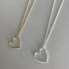 A dainty heart stackable necklace.  Material: sterling silver / 14 karat gold plated  Size: heart 15.2mm / chain 16-18 inch Simple Heart Pendant Charm Necklace As Gift For Her, Simple Heart Pendant Necklace For Everyday, Dainty Heart Pendant Charm Necklace For Everyday, Dainty Everyday Heart Pendant Charm Necklace, Dainty Heart Charm Necklace For Everyday, Delicate Sterling Silver Heart Necklace For Everyday, Open Heart Charm Necklace Gift For Her, Minimalist Open Heart Charm Necklace As Gift For Her, Minimalist Open Heart Charm Necklaces