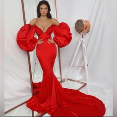 Custom Made From Kosovo. Worn Once. This Vibrant Red Will Streak The Show Because Of Its Old Hollywood Style, Poofy Off The Shoulder Sleeves. Mermaid Cut With A Bit Of Stretch. It Says Size Small But Can Fit A Medium 00-6 Must Have To Win The Crown!!! Stand Out In This Bold, Classic, One Of A Kind Glamorous Red Satin Evening Dress, Red V-neck Gown For Banquet, Red Satin Evening Dress For Red Carpet, Long Sleeve Evening Dress For Red Carpet, Fitted Red Evening Dress For Banquet, Red Fitted Long Sleeve Evening Dress, Red Glamorous Gown For Banquet, Glamorous Red Gown For Banquet, Elegant Red Long Sleeve Gown