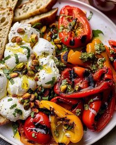 a white plate topped with vegetables and bread