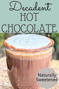 a close up of a cup of hot chocolate on a table with text overlay that reads slow cooker hot chocolate