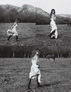 three women in white dresses are playing frisbee on a field with mountains in the background