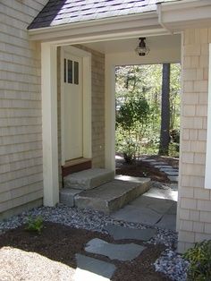 an entry way to a house with stone steps