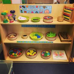 a wooden shelf filled with lots of different toys and crafts on it's sides