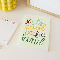 a notepad with the words it's cool to be kind written on it