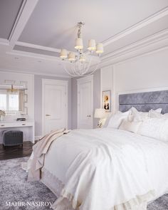 a large white bed sitting in a bedroom next to a chandelier and two lamps