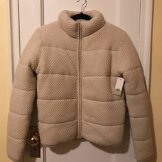 Soft Knit Puffer Jacket. Size S. Cream. Completely Unworn. Trendy Cream Cable Knit Outerwear, Trendy Cable Knit Cream Outerwear, Beige Stretch Winter Outerwear, Winter Beige Stretch Outerwear, Fitted Knit Beige Outerwear, Fitted Knitted Beige Outerwear, Fitted Beige Knitted Outerwear, Fitted Beige Knit Outerwear, Cozy Beige Stretch Outerwear