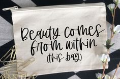 beauty comes from within this bag on a black and white checkered tablecloth with flowers