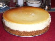 a cheesecake sitting on top of a metal pan