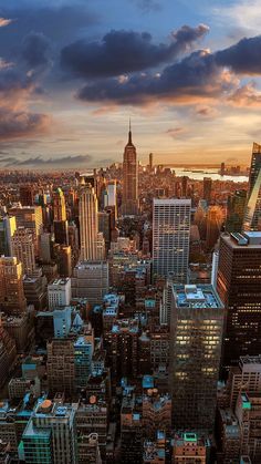 an aerial view of new york city at sunset