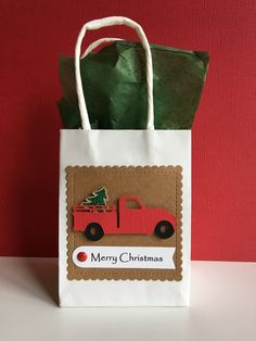 a paper bag with a christmas truck on it