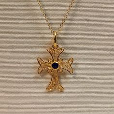 Filigree work handmade Greek cross made of 18 carat solid yellow gold ,Tre cross is adorned with spirals and in the center has blue enamel , It's made in Greece in one of the most famous jewelry workshops that they are specialized making filigree work An elegant small everyday use cross that can be a special gift for any occasion You can also order the cross with different color enamel like green, red, light blue,it will take four working days to preare You can buy the cross with or without the Byzantine Yellow Gold Cross Necklaces, Byzantine Yellow Gold Cross Necklace, Yellow Gold Filigree Cross Jewelry, Traditional Cross Jewelry With Intricate Design, Byzantine Style Yellow Gold Cross Pendant Jewelry, Byzantine Style Cross Jewelry In Yellow Gold, Byzantine Yellow Gold Cross Jewelry, Yellow Gold Byzantine Cross Jewelry, Traditional Filigree Cross Jewelry