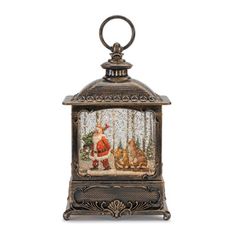 an old fashioned christmas lantern with santa and his reindeers