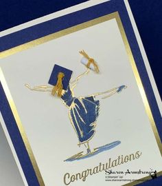 a card with a girl holding a blue graduation cap and gold trimmings on it