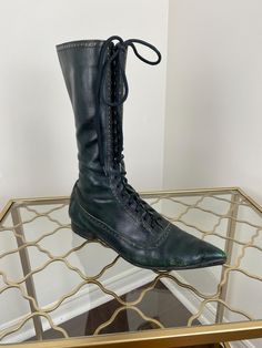 Funky green lace up Fluevog Boots. Please see further details below. Label - Fluevog Made in England Leather upper, leather sole, sole has heel cap and rubble cap. Size 7 US  1" heel 12.5" tall  Widest part of exterior sole is approximately 3.5"  Exterior sole length (including pointy toe) 11.5" approximately Front lace closure.  Good/fair vintage condition. These show signs of surface wear to the leather with nicks and colour loss. Structurally they seem to be in very good shape and the soles s Boots Cottagecore, Fluevog Boots, Boots Victorian, Steampunk Boots, Grunge Boots, Victorian Boots, Witch Boots, Pointy Toe Flats, Heel Caps