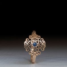 A Timelessly beautiful Victorian Style Gold ring set with a Blue Sapphire and Flourished with Antique Floral patterns. Sheer beauty and Elegance in this Charming treasure of a ring. Perfect to Wear Everyday or to special event. This Victorian Style Ring is decorated with a 12mm Wide and long Pattern. Made with Your Choice Gold Karat That can be chosen from the menu on this page. All rings Sizes available The Sapphire is 2.5mm Natural Cabochon, All other Stone requests are welcome * All items Han Medieval Ring, Victorian Style Rings, Medieval Rings, Ruby Rings, Vintage Inspired Rings, Princess Cut Rings, Victorian Rings, Gold Ring Sets, Rings Gold