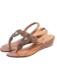 The Victoria Mini Wedge Sandal is handcrafted sewn beads and crystals stitched with sequins. Pair with your favorite floral dress, skinny jeans or shorts, these sandals will provide you everyday comfort with effortless style. You will fall in love with the comfort and never want to take them off! Elastic Leather ankle strap Smooth leather lining with embossed logo Lightly padded footbed Leather & rubber outsole Handmade in Bali Embellished Wedding Sandals For Summer, Embellished Wedge Sandals For Beach, Embellished Wedge Heel Sandals For Beach, Crystal Embellished Wedge Heel Sandals, Embellished Wedge Heel Sandals For Summer, Elegant Embellished Sandals For Vacation, Elegant Embellished Wedge Heel Sandals, Boho Chic Shoes, Red Leather Shoes