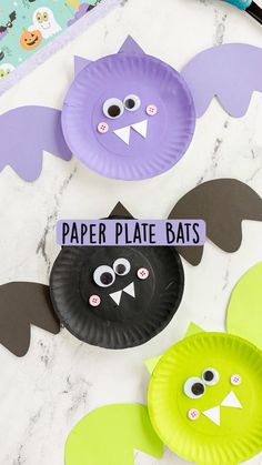 paper plate bats are displayed on a table