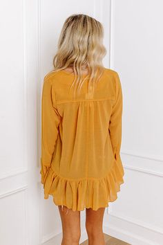 - Show your unique style with this flowy top! - Unlined sheer material with a subtle texture - A ruffled v-cut neckline - A button-up front - Long bell sleeves with cuff button detail - A relaxed silhouette that ends in a ruffle hemline Measurements S : Bust 44", Hip 48", Length 28", Sleeve Length 25", Waist 46". M : Bust 46", Hip 50", Length 28", Sleeve Length 25.5", Waist 48". L : Bust 48", Hip 52", Length 28.5", Sleeve Length 25.5", Waist 50". Long Bell Sleeves, Flowy Top, Sheer Material, Positive Affirmation, Flowy Tops, V Cut, V Cuts, Women Clothing Boutique, Button Detail