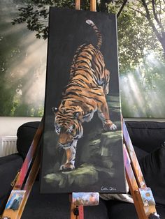 a painting of a tiger on an easel