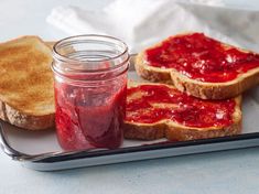 two pieces of toast with jam on them