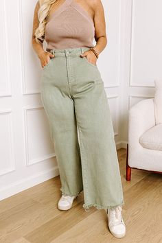 - Build your OOTD around these stylish wide legged jeans! - Unlined stretchy denim material - A mid rise waistline with belt loops, a hidden zip fly, and button closure - Functional front and back pockets - A wide legged silhouette that ends in unfinished, frayed hemlines Mid-rise Green Jeans With Belt Loops, Fitted Green Wide-leg Jeans, Mid-rise Utility Flare Jeans With Belt Loops, Green Wide-leg Jeans With Side Pockets, Green Cotton Wide-leg Flare Jeans, Wide Legged Jeans, Denim Material, Mid Rise, Wide Leg