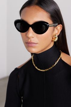 Oliver Peoples and Khaite's collaboration blends some of our favorite vintage and modern styles. These '1968C' sunglasses nod to the classic cat-eye but with a softened, more oval shape. Truly timeless, they're made from black acetate with gold-tone arms. Tone Arms, Oliver Peoples Sunglasses, Tortoiseshell Sunglasses, Lux Life, Italian Sunglasses, Round Eyewear, Flat Dress Shoes, Toned Arms, Exclusive Shoes