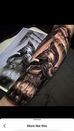 a man's arm with tattoos on it, and an image of a person in armor