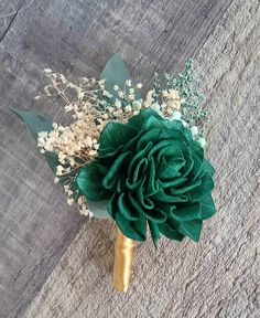 a bouquet of flowers sitting on top of a wooden table