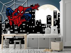 a bedroom with a spiderman mural on the wall and cityscape in the background