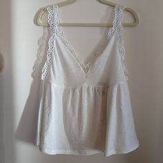 New With Tags, Beautiful Camisole Style In Soft White. Has V-Neck With Seaming Under The Bust And Flowy. Also Has Deep V In Back. Has Eyelet Detail On Shoulders And Bust. So Pretty!! Size L By Umgee Summer V-neck Crop Top With Lace Trim, Feminine V-neck Crop Top For Beach, White V-neck Crop Top For Spring, White V-neck Crop Top For Summer, Casual V-neck Crop Top With Lace Trim, Cotton V-neck Camisole For Brunch, Spring V-neck Camisole With Lace Trim, White V-neck Summer Crop Top, V-neck Crop Top With Lace Trim For Spring