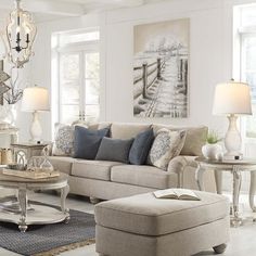 a living room filled with furniture and decor