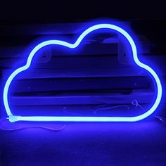 a neon blue cloud shaped light up sign