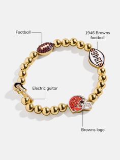 The Cleveland Browns NFL Charm Bracelet is the ultimate accessory for die-hard football fans. Each bracelet is a celebration of your favorite team, featuring the Browns logo along with other charms related to the team and its iconic location. Perfect for game days or everyday wear, this bracelet adds a touch of sports-inspired elegance to any outfit. This bracelet features 6mm gold ball beads. This is an officially licensed NFL product. Beaded Charm Bracelet, Browns Football, Browning Logo, Bead Charm Bracelet, Cleveland Browns, Die Hard, Football Fans, Favorite Team, Cleveland