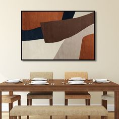 a dining room table with place settings and plates on it, in front of an abstract painting