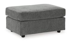 a grey ottoman with black legs on a white background