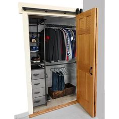 an open closet with clothes and shoes in it