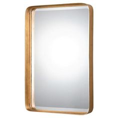 a gold framed mirror on a white wall